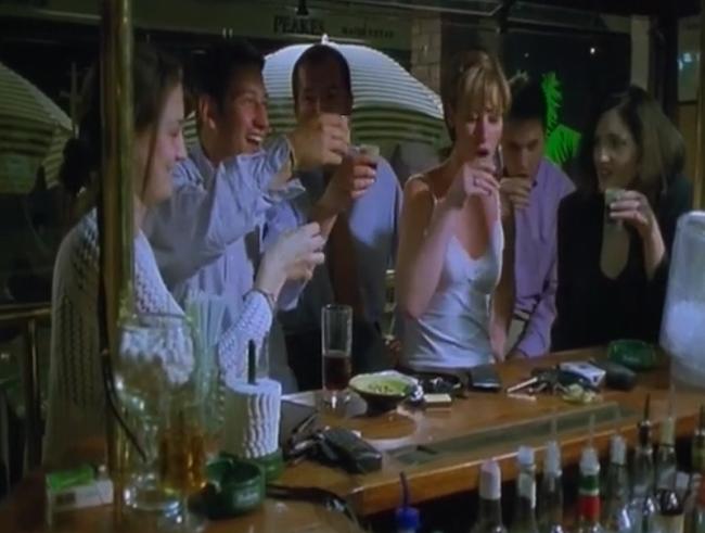 Drinking for England (BBC2) 1 Group of adults standing at the bar drinking alcohol.