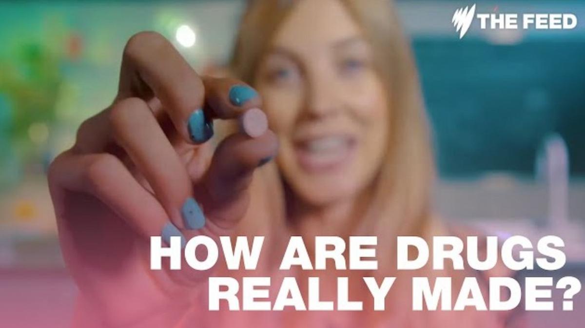 A close-up of Nellie Benner, Host of Drugs Lab, holding up an MDMA / ecstasy pill, with the title, How Are Drugs Really Made?
