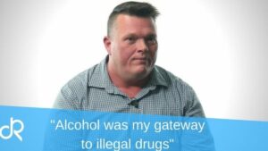 Brady sitting and discussing his addiction story, with the title "Alcohol was my gateway to illegal drugs"