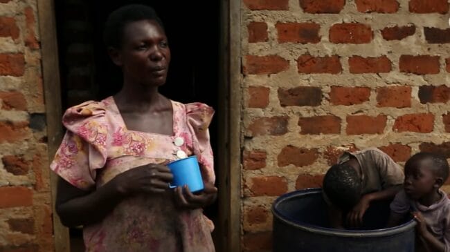 Image of a local woman from Cover photo for Uganda’s Waragi (Moonshine) Epidemic video